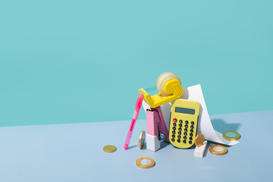 Pastel office supplies with euro coins still life
