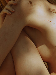 Fototapeta premium Aesthetic sunbathing on the beach 