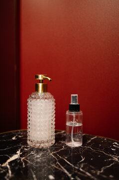 Soap and sanitizer on marble table

