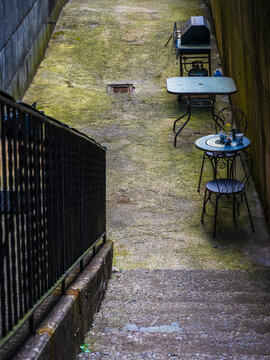 bbq grill and table in an alley
