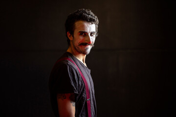 Joker with a mean face looking into the camera