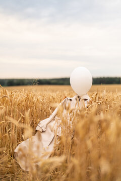 Vertical shot of the lonely balloon with clothes at the hanger