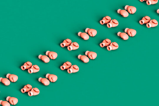 rows of Pink boxing gloves with copy space