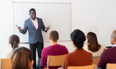 University teacher conducts a lesson for students
