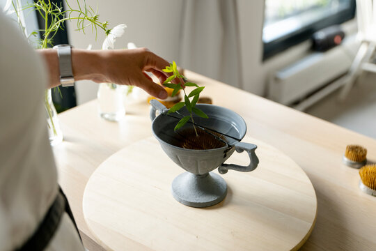 Female florist in a studio creating a beautiful bouquet 