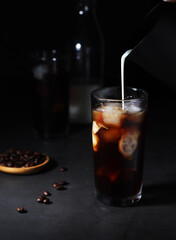 Cold coffee with ice in low key