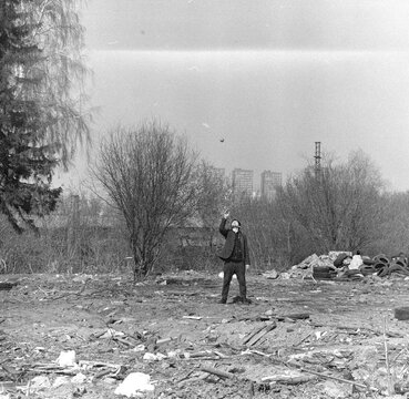 Man playing with a ball on the street.