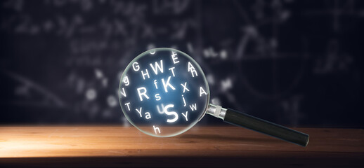 Magnifying glass and latin letters