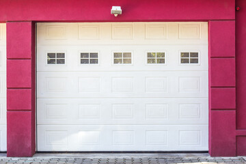 Fototapeta premium Red facade of home with home garage