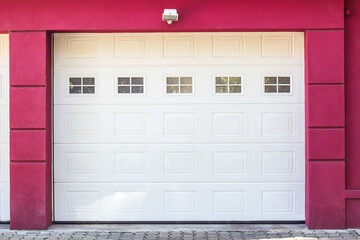 Red facade of home with home garage
