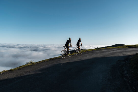 Cyclists riding on mountain trail