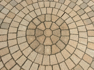 Circular paver bricks in sunlight