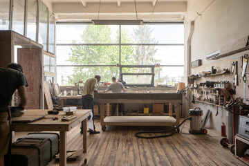 Two working male in work suit working attentively at the table