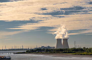 Antwerpen, Flanders, Belgium - July 10, 2022: Cooling towers and Doel Nuclear Power plant behind...