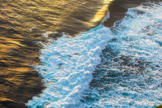 Ocean waves crashing dusk in nature landscape