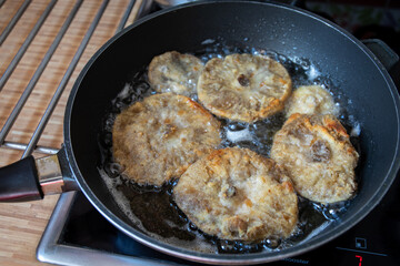 frying pan with breaded mushrooms, Czech cuisine dish