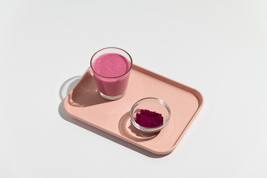 Pitaya dragon fruit healthy superfood drink with glass, bottle powder