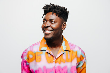 Cheerful black man in trendy outfit