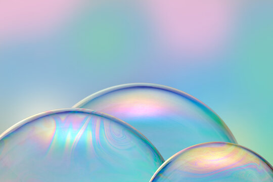 Translucent soap bubbles with color glow.