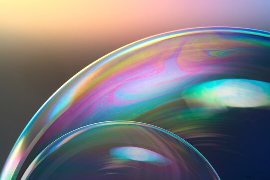 Transparent soap bubbles with iridescent pattern.