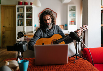 Guitarist singing song during live stream