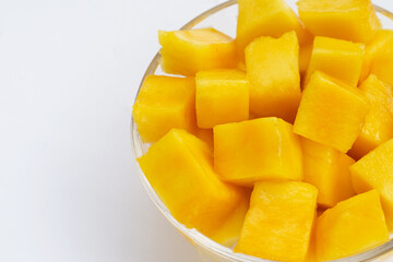 Yellow mango slices on white background.