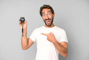 young crazy bearded and expressive man with a stopwatch timer. fast concept