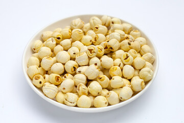 Dried lotus seeds on white background.