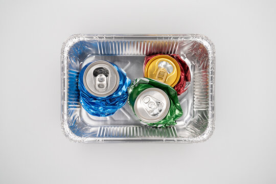 Compressed soda cans which symbolizing recycling problems
