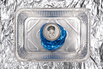 Compressed soda can which symbolizing recycling problems