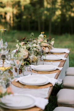 close up of wedding reception table setting with flower arrangements