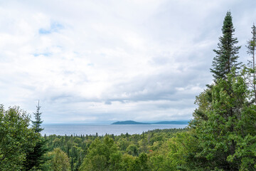 Fototapeta na wymiar Lake Superior is seen from a forested lookout on the way to Michipicoten Harbour from Wawa, Ontario.