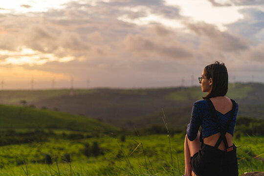 Young girl looking at a landscape.