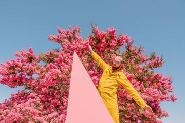 Man poses with triangle