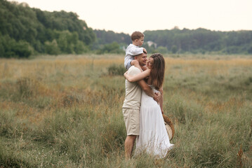 young family in the field 
