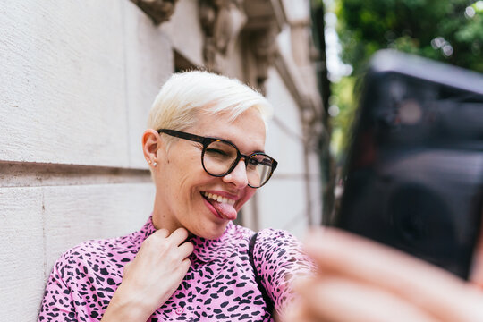 Smiley Woman Taking A Selfie 