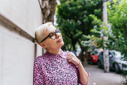 Vibrant Woman Against Wall