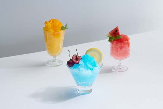 shaving ice in glass dessert glasses on light background