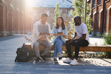 Classmates collaborating in assignment  