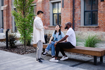 Friends having small talk on street 