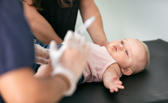 Exam: Baby Looks At Syringe With Apprehension