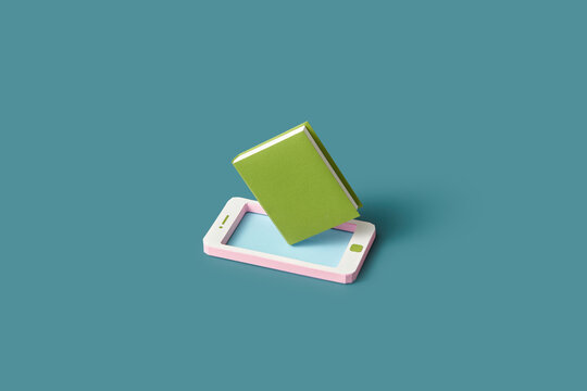 Papercraft mobile phone and book.