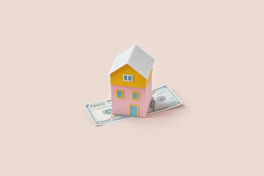 Multicolored papercraft house over 100 dollars.
