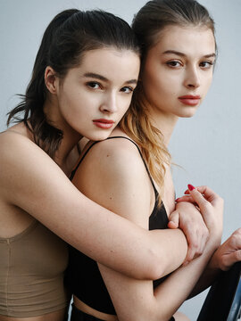 Portrait of young beautiful model sisters
