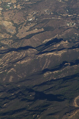 Aerial Image Of Hills With Some Dwellings Mostly Green Trees