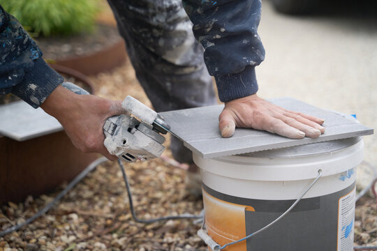 Tiler Cutting Tile