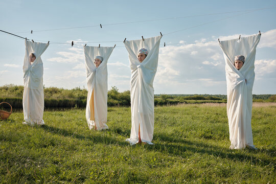 Four Slavic Women In White Fabric