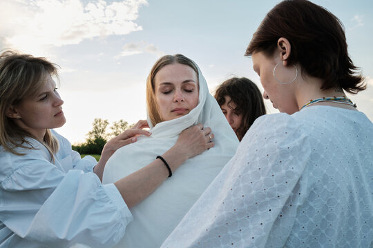 Wrapping Woman In White Fabric