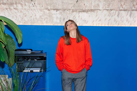 Young woman in casual wear in office