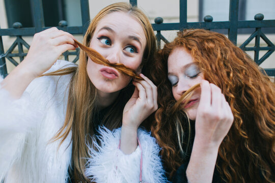 Two Women Making Fun Of The Camera